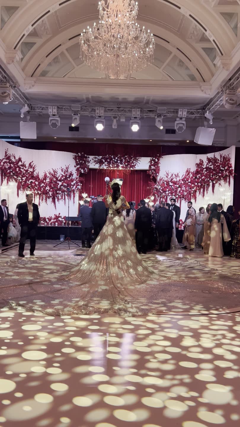 A gown's train crossing a ballroom dance floor at a recent wedding